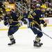 Michigan defensemen Lee Moffie and Mac Bennett watch a puck in the game against Miami on Saturday, March 23. Daniel Brenner I AnnArbor.com